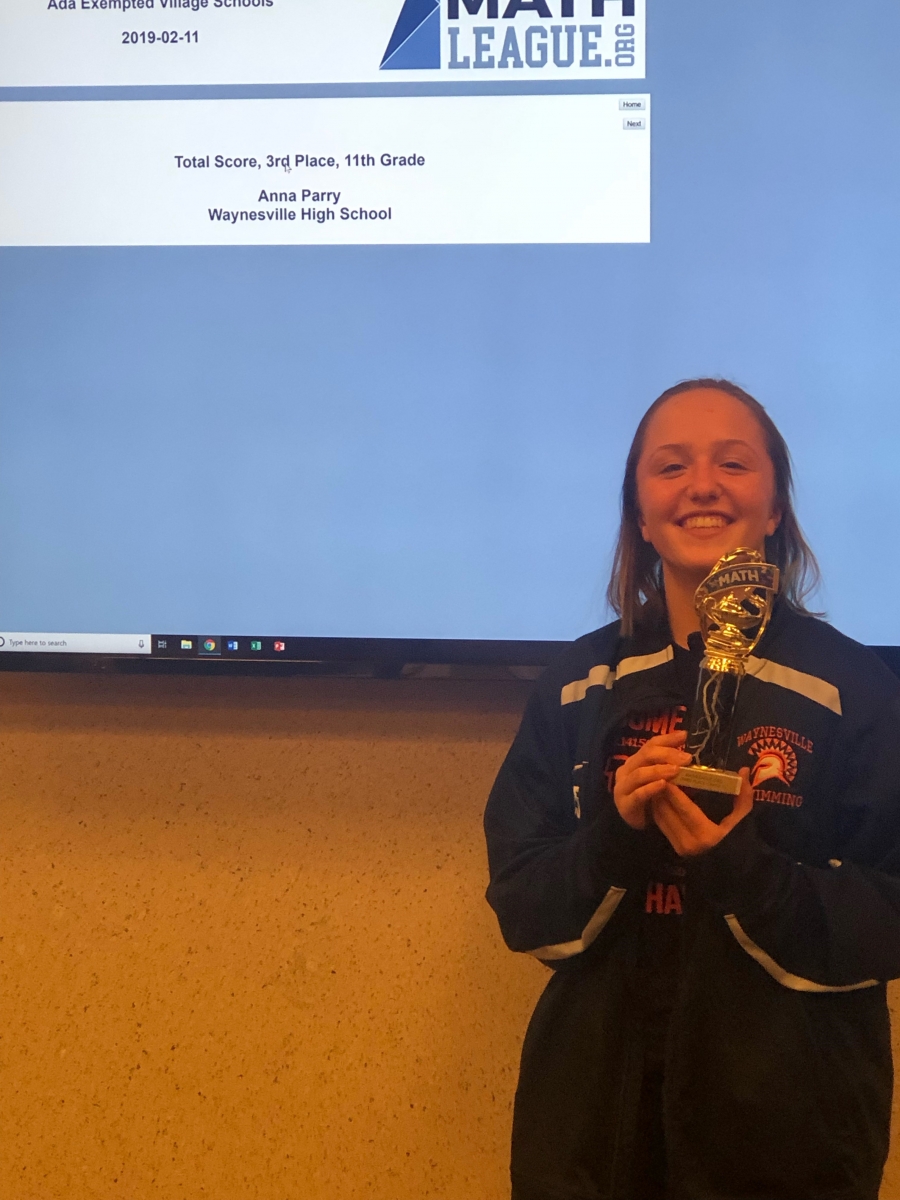 girl holding a trophy